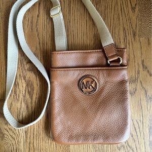 Michael Kors cross body bag — chestnut colored leather
